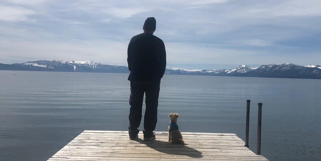 Mike and his dog on a dock